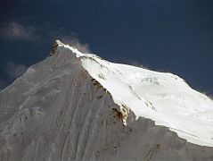 15 Chogolisa I And Long Ridge To Chogolisa II Close Up Late Afternoon From Shagring Camp On Upper Baltoro Glacier Chogolisa I (7665m) is on the left and Chogolisa II (7654m) is on the right, seen from Shagring camp on the Upper Baltoro Glacier. On August 4, 1958 a Japanese expedition organized by the Academic Alpine Club of Kyoto led by Takeo Kawabara made the first ascent of Chogolisa II, with Masao Fujihira and Kazumasa Hirai reaching the summit. The first ascent of Chogolisa I (7665m) was made on August 2, 1975 by Fred Pressl and Gustav Ammerer of an Austrian expedition led by Eduard Koblmuller. Koblmuller almost suffered the same fate as Hermann Buhl, as he also fell through a cornice on the ascent; fortunately, he was roped and team members were able to pull him to safety.